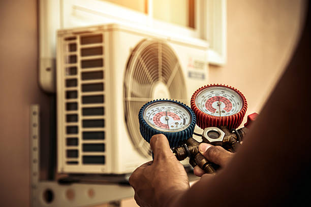 Professional Air Conditioning Service technician working in Roseville, MN